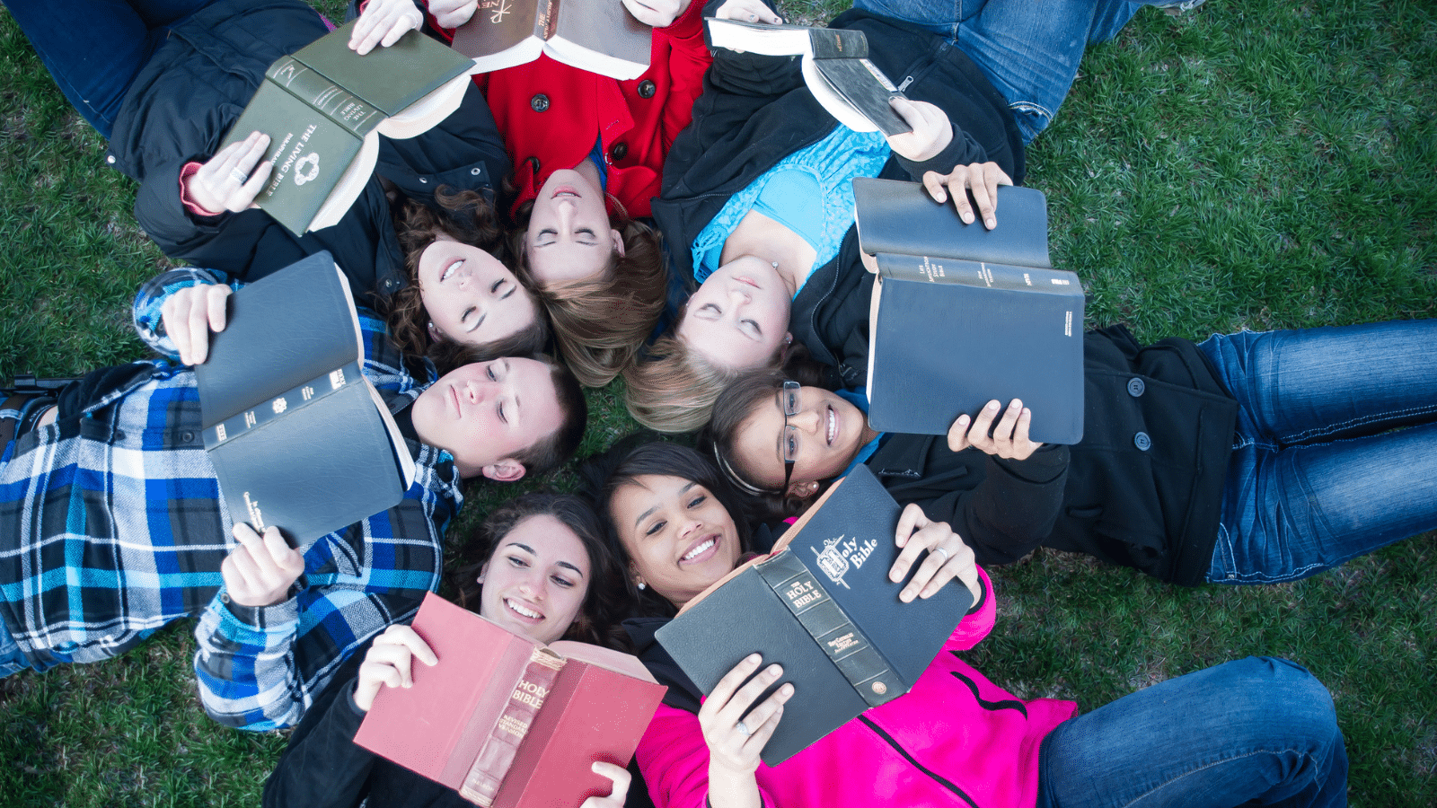 teens reading Bibles in a circle