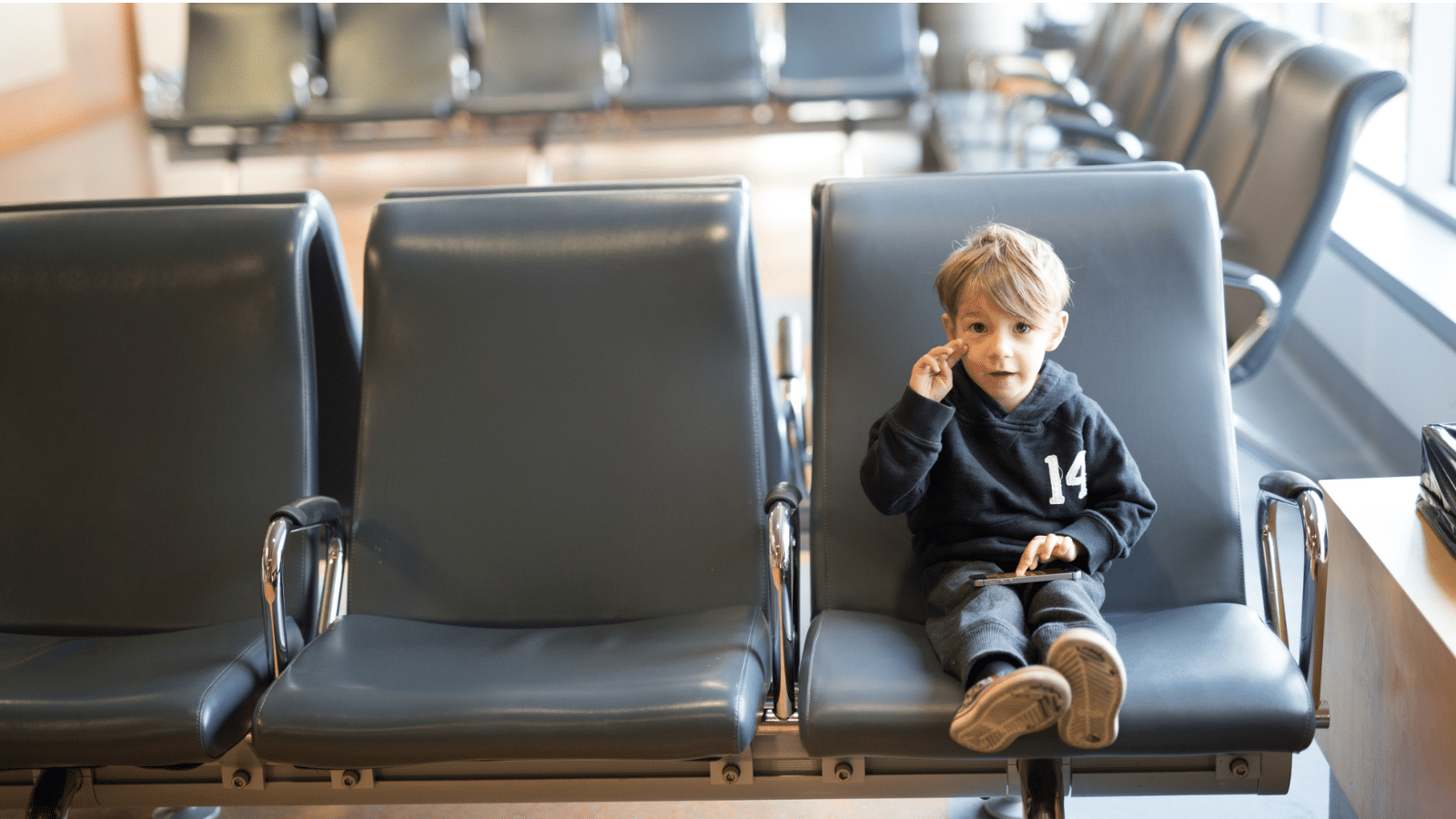 boy waiting in airport