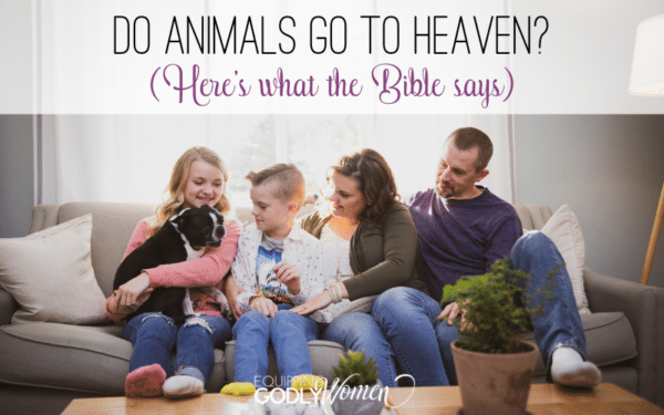 Family sitting on couch with pet dog