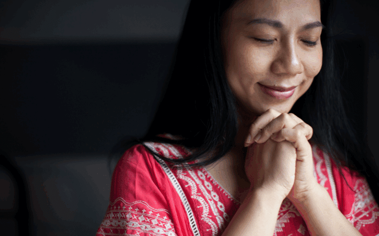 Woman praying with confidence