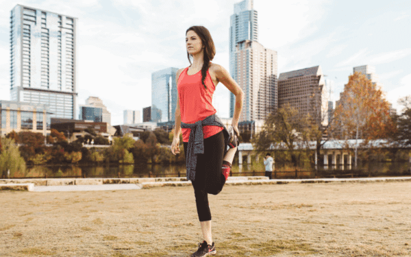 Woman running stretching